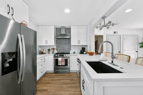 a dining room with furniture and wooden floor