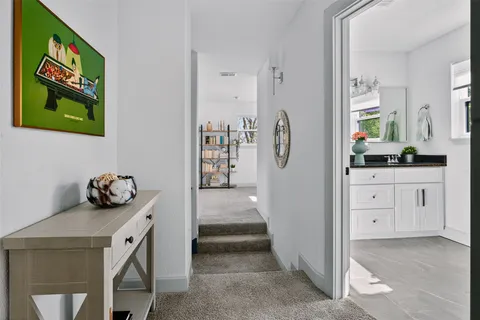 a view of living room with furniture and flat screen tv