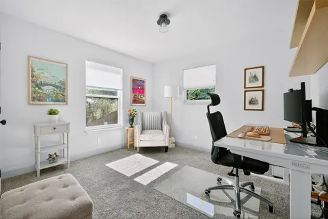a kitchen with a refrigerator and cabinets