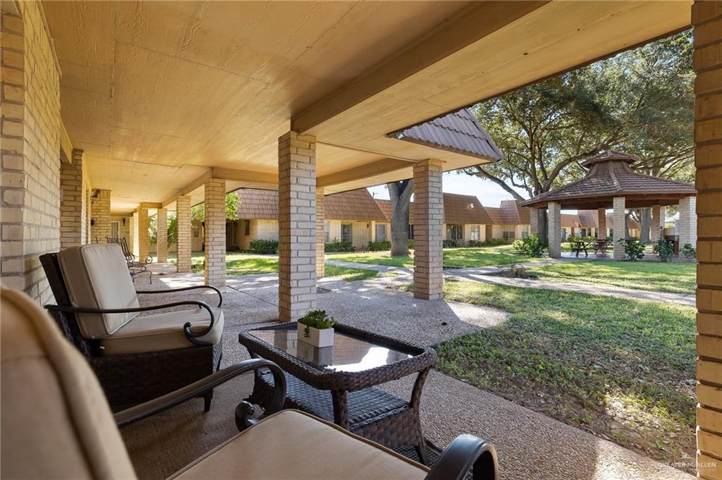 500 East El Rancho Avenue, Unit 36 McAllen, TX 78503 - Photo 3 of 16 a view of a patio with a table chairs and a backyard