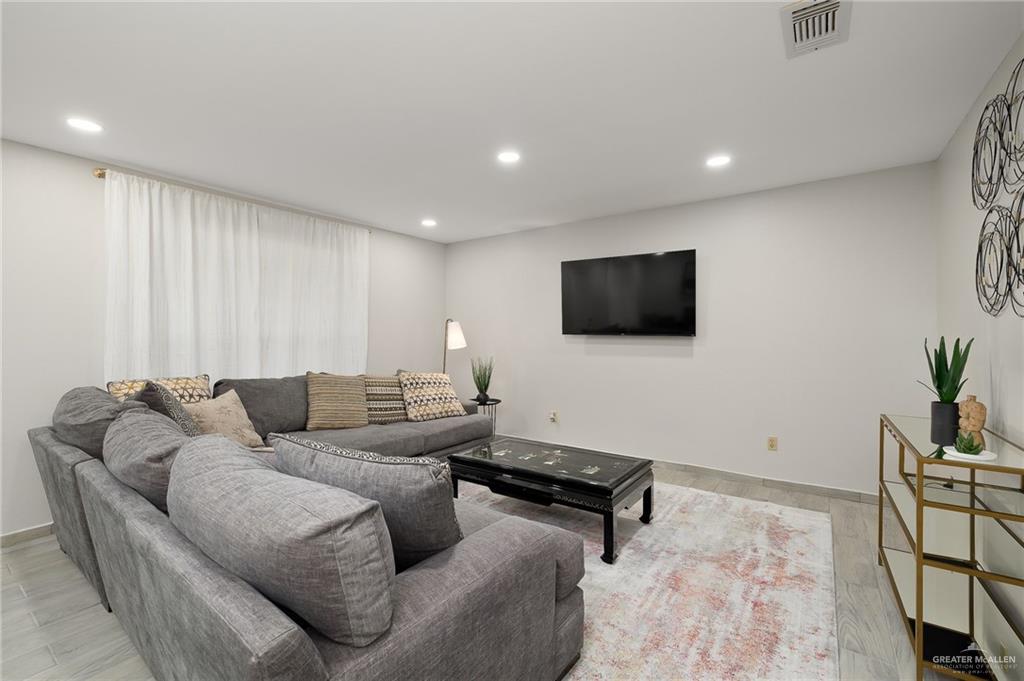 500 East El Rancho Avenue, Unit 36 McAllen, TX 78503 - Photo 4 of 16 a living room with furniture and a flat screen tv