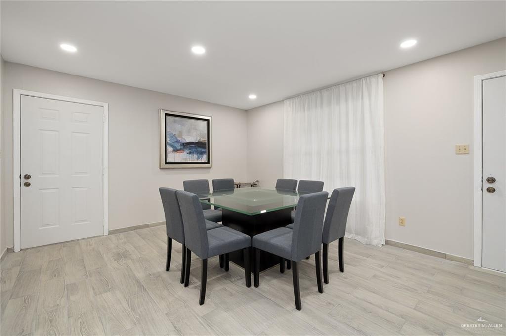 500 East El Rancho Avenue, Unit 36 McAllen, TX 78503 - Photo 6 of 16 a view of a dining room with furniture and wooden floor