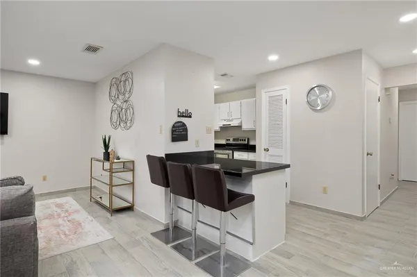 a view of kitchen with cabinets and wooden floor
