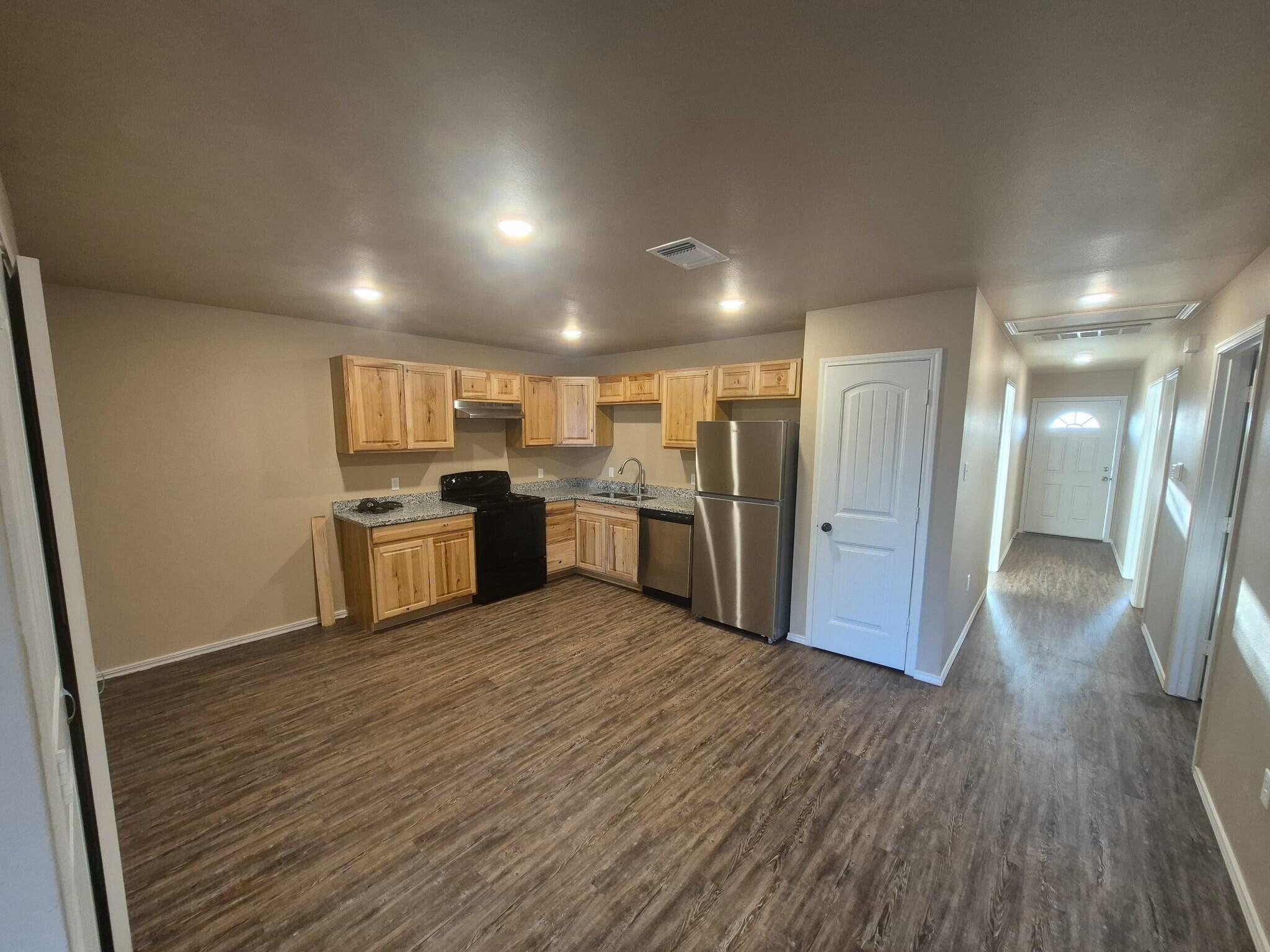 2506 Avenue P Lubbock, TX 79411 - Photo 1 of 11 a view of kitchen with wooden floor