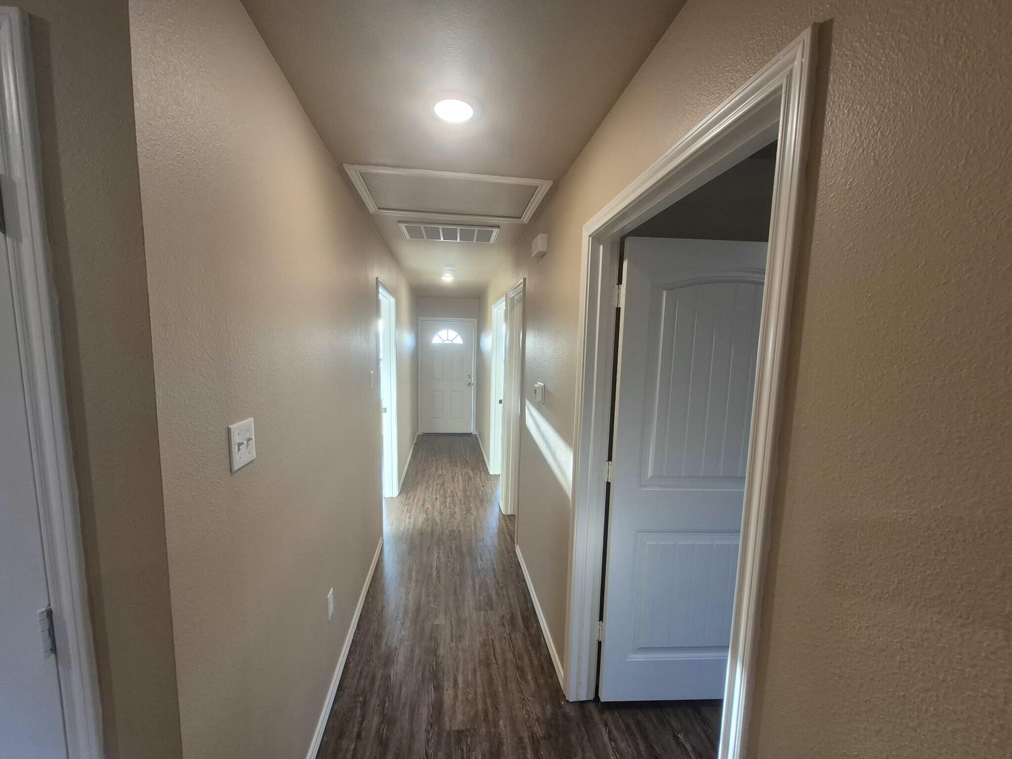2506 Avenue P Lubbock, TX 79411 - Photo 8 of 11 a view of hallway with wooden floor