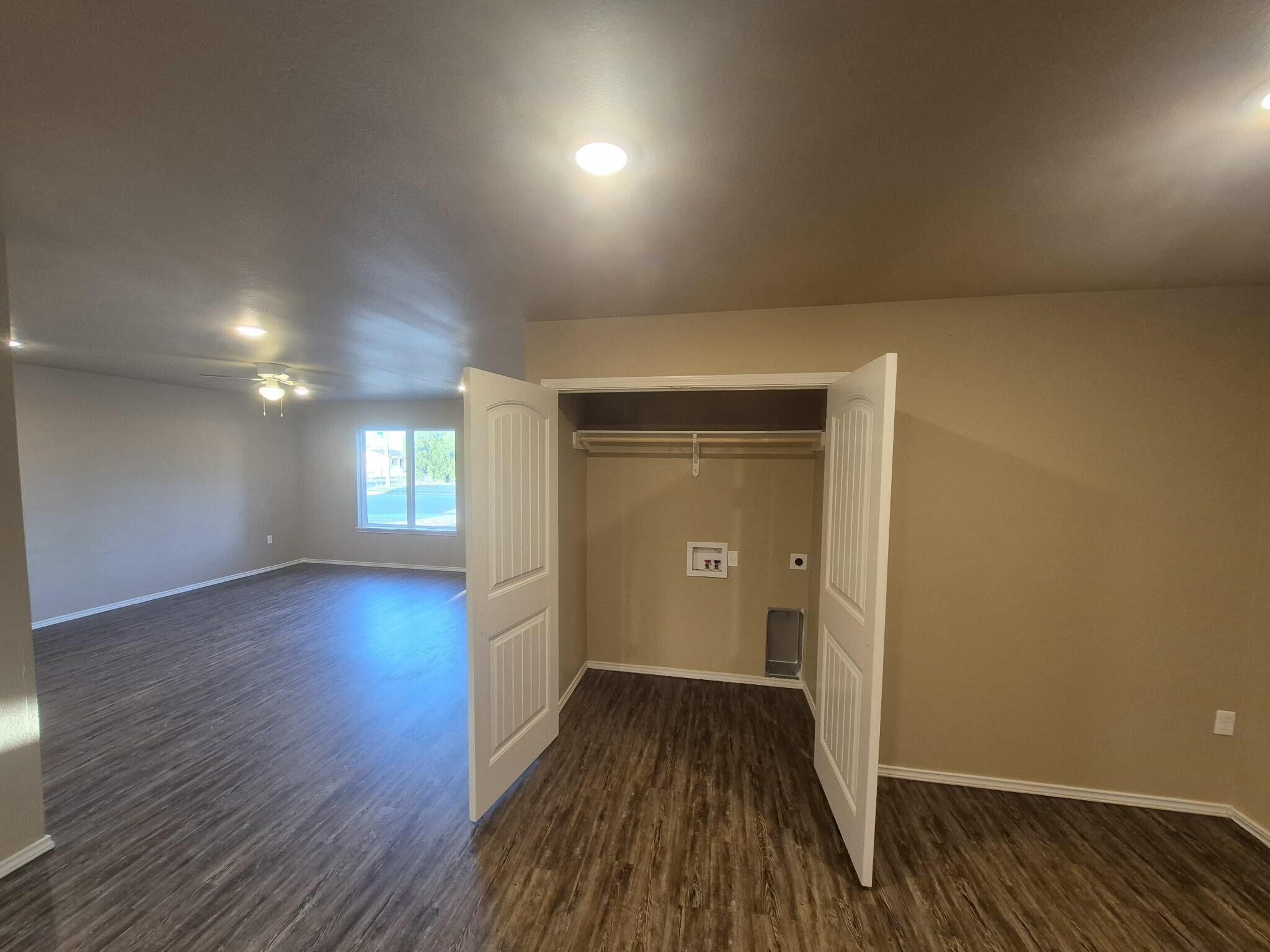 2506 Avenue P Lubbock, TX 79411 - Photo 9 of 11 wooden floor in an empty room with a window