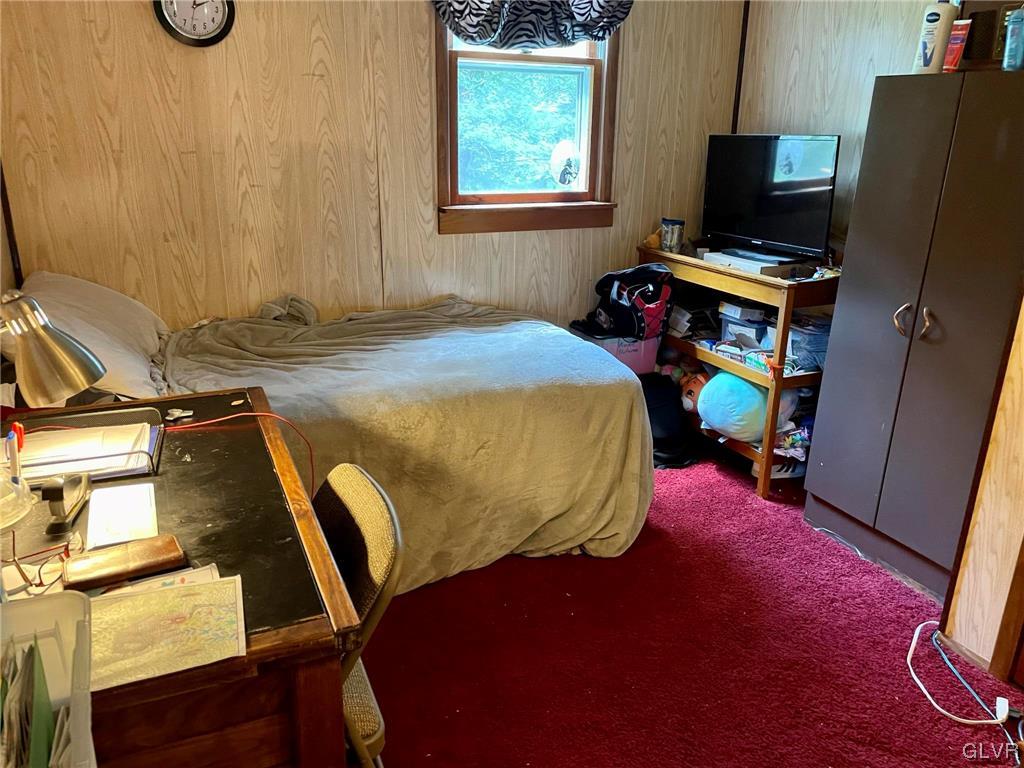 124 Haney Road Kunkletown, PA 18058 - Photo 14 of 24 a bedroom with a bed and a flat screen tv