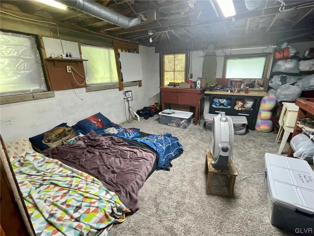 124 Haney Road Kunkletown, PA 18058 - Photo 15 of 24 a bedroom with furniture and a large window