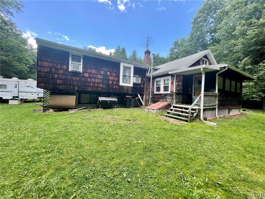 124 Haney Road Kunkletown, PA 18058 - Photo 19 of 24 a view of a house with a yard and sitting area