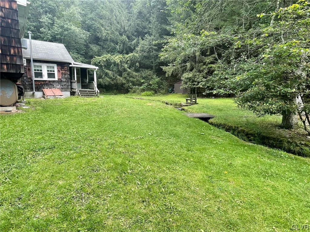 124 Haney Road Kunkletown, PA 18058 - Photo 20 of 24 a view of a house with a big yard and large trees