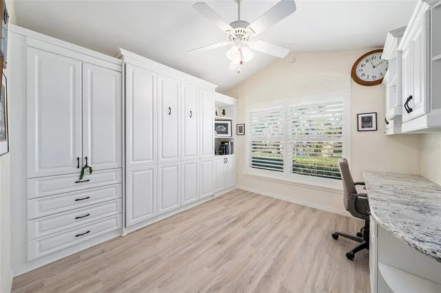 a large kitchen with stainless steel appliances lots of counter top space