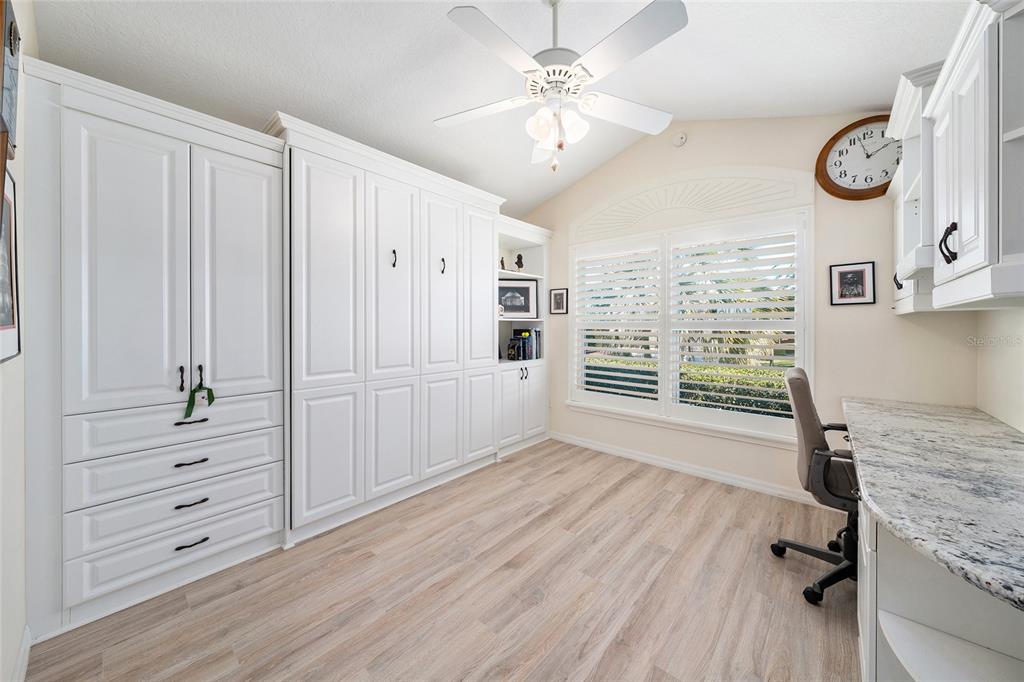 2416 Boiling Springs Court The Villages, FL 32162 - Photo 11 of 41 a view of a workspace with furniture and a window