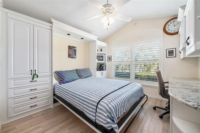 a spacious bathroom with a double vanity sink a large mirror and shower