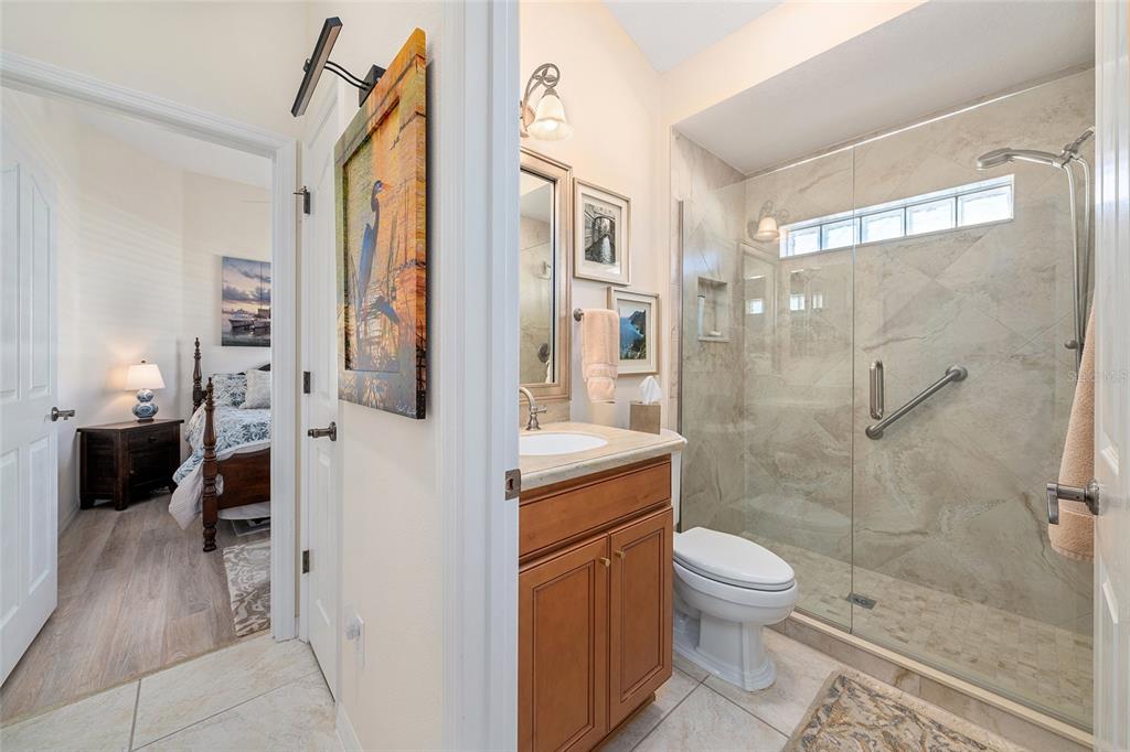 2416 Boiling Springs Court The Villages, FL 32162 - Photo 15 of 41 a bathroom with a granite countertop shower a toilet and a sink