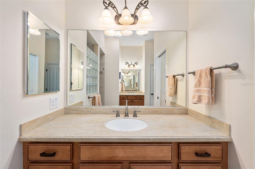 2416 Boiling Springs Court The Villages, FL 32162 - Photo 32 of 41 a bathroom with a sink and a mirror