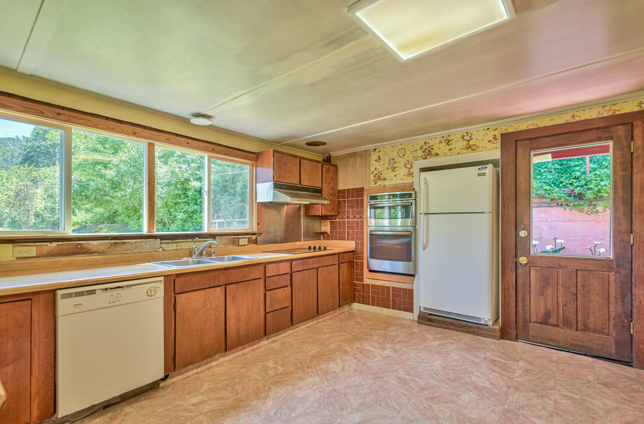 28120 Schulte Road Carmel, CA 93923 - Photo 18 of 42 a kitchen with a refrigerator and a sink