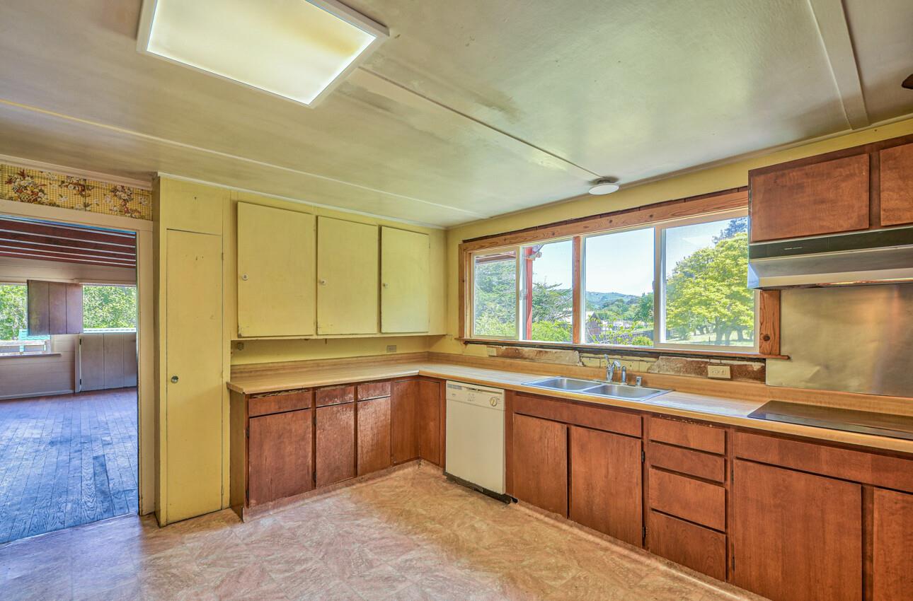28120 Schulte Road Carmel, CA 93923 - Photo 20 of 42 a kitchen with a sink window and cabinets