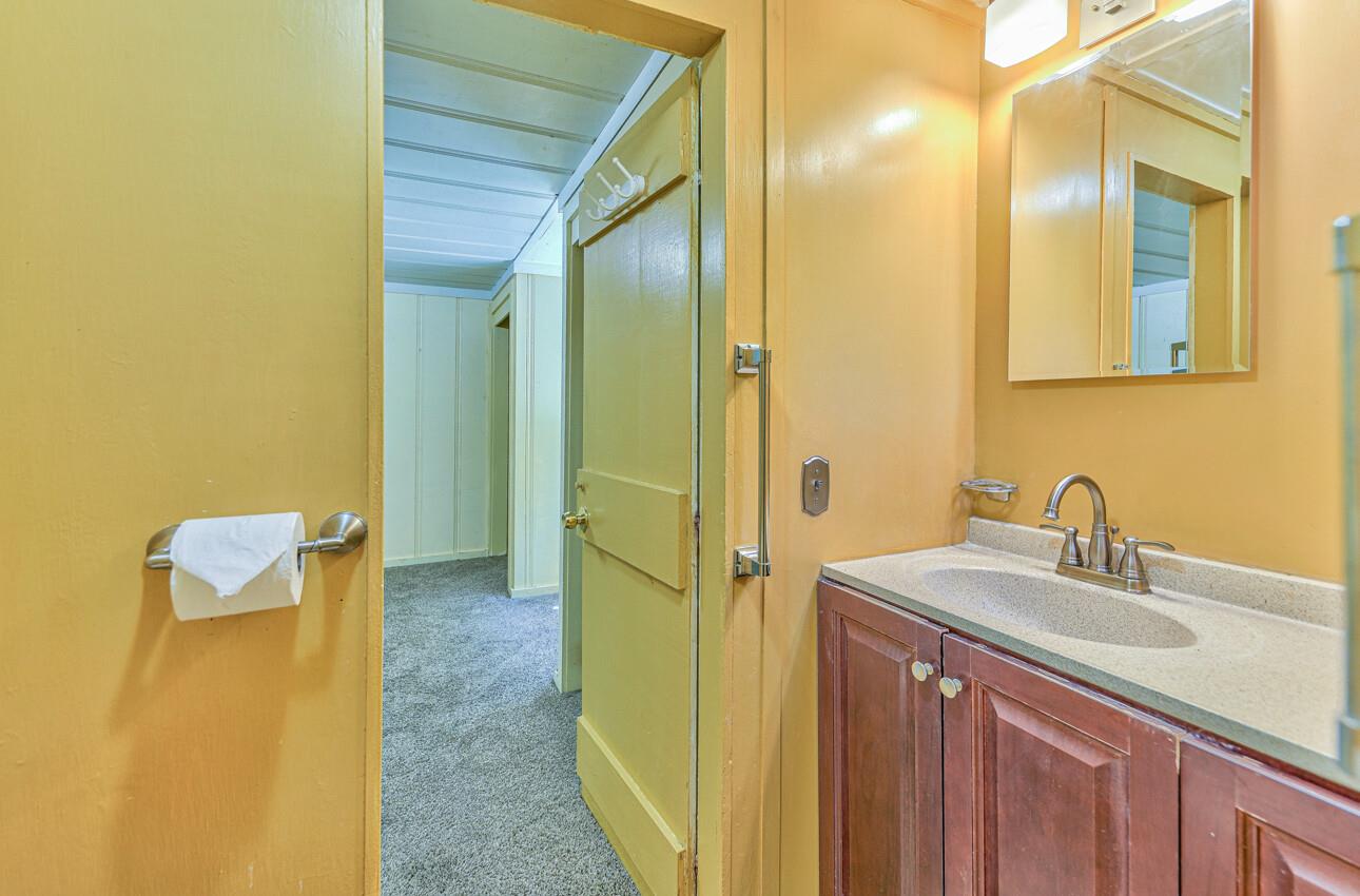 28120 Schulte Road Carmel, CA 93923 - Photo 27 of 42 a bathroom with a sink and a mirror