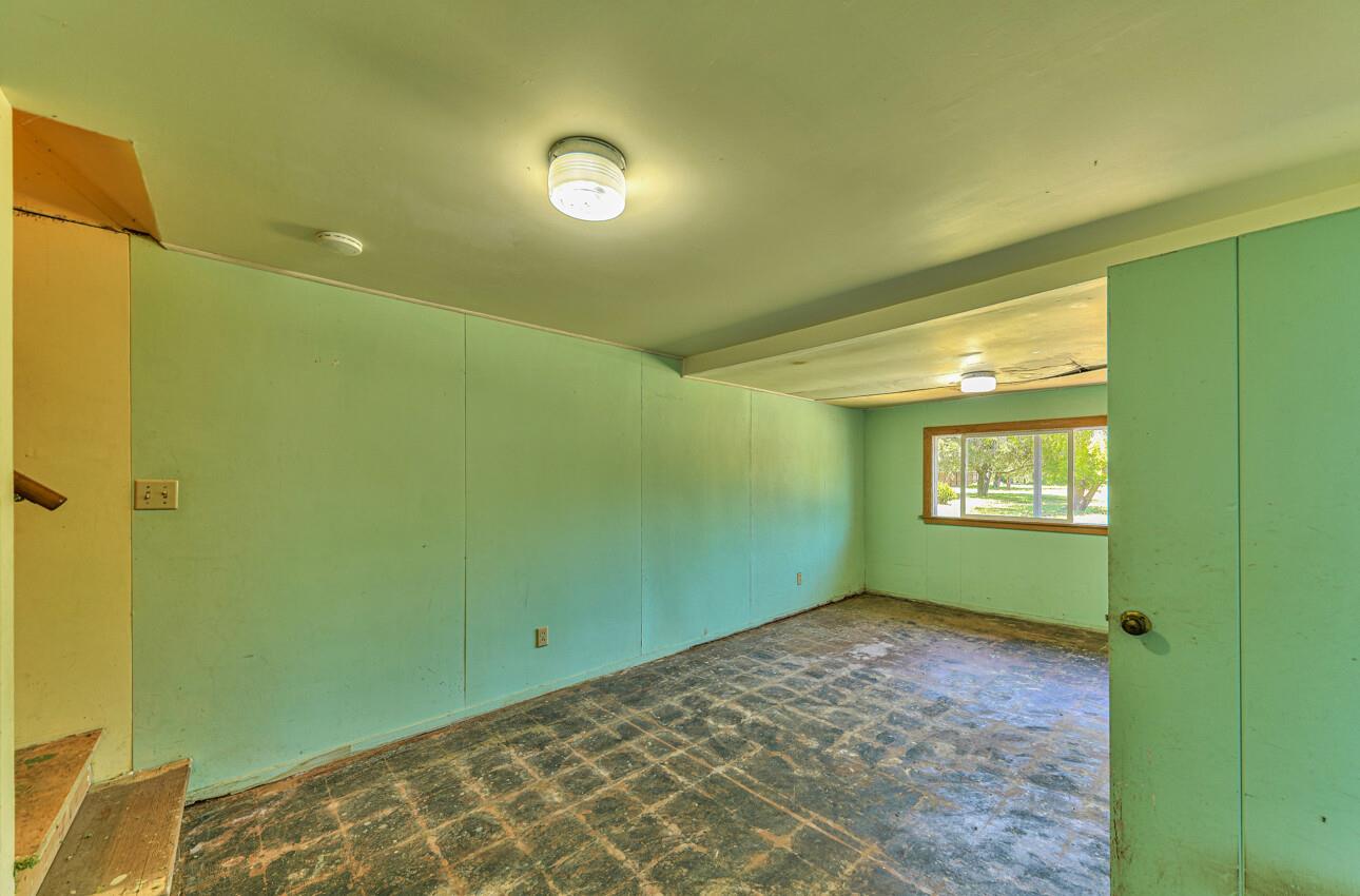 28120 Schulte Road Carmel, CA 93923 - Photo 38 of 42 a view of an empty room with window and stairs