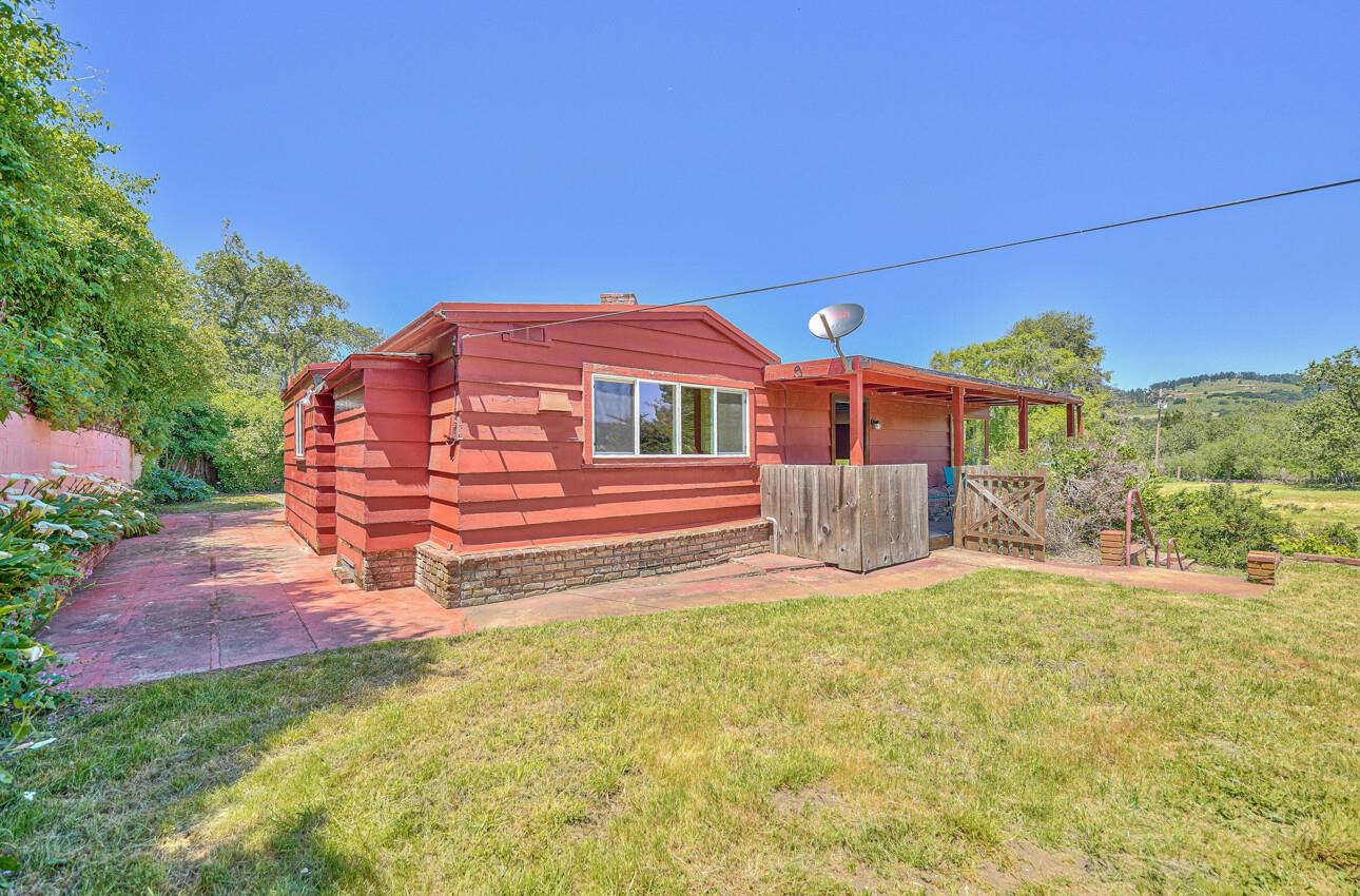 28120 Schulte Road Carmel, CA 93923 - Photo 4 of 42 a front view of a house with a yard and garage