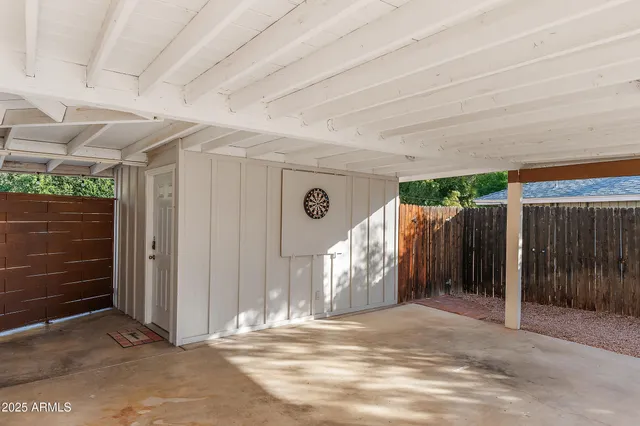 a view of a house with a chairs in patio