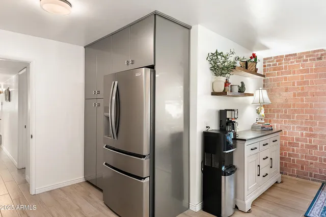 a kitchen with stainless steel appliances a refrigerator and a stove