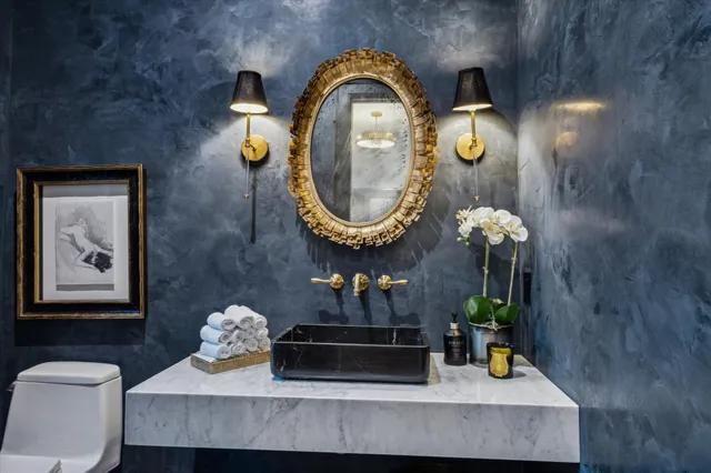 a living room with furniture and a mirror