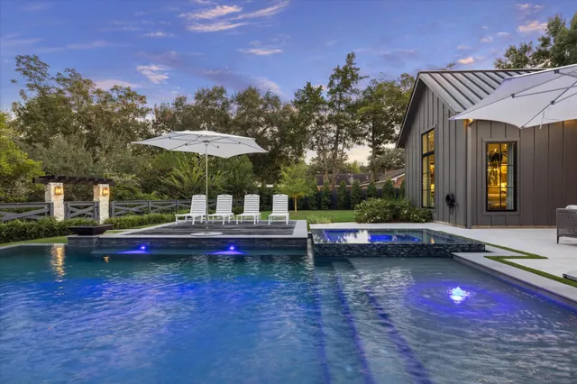 a view of swimming pool with outdoor seating