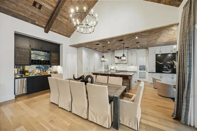 a living room with stainless steel appliances kitchen island granite countertop furniture and a kitchen view