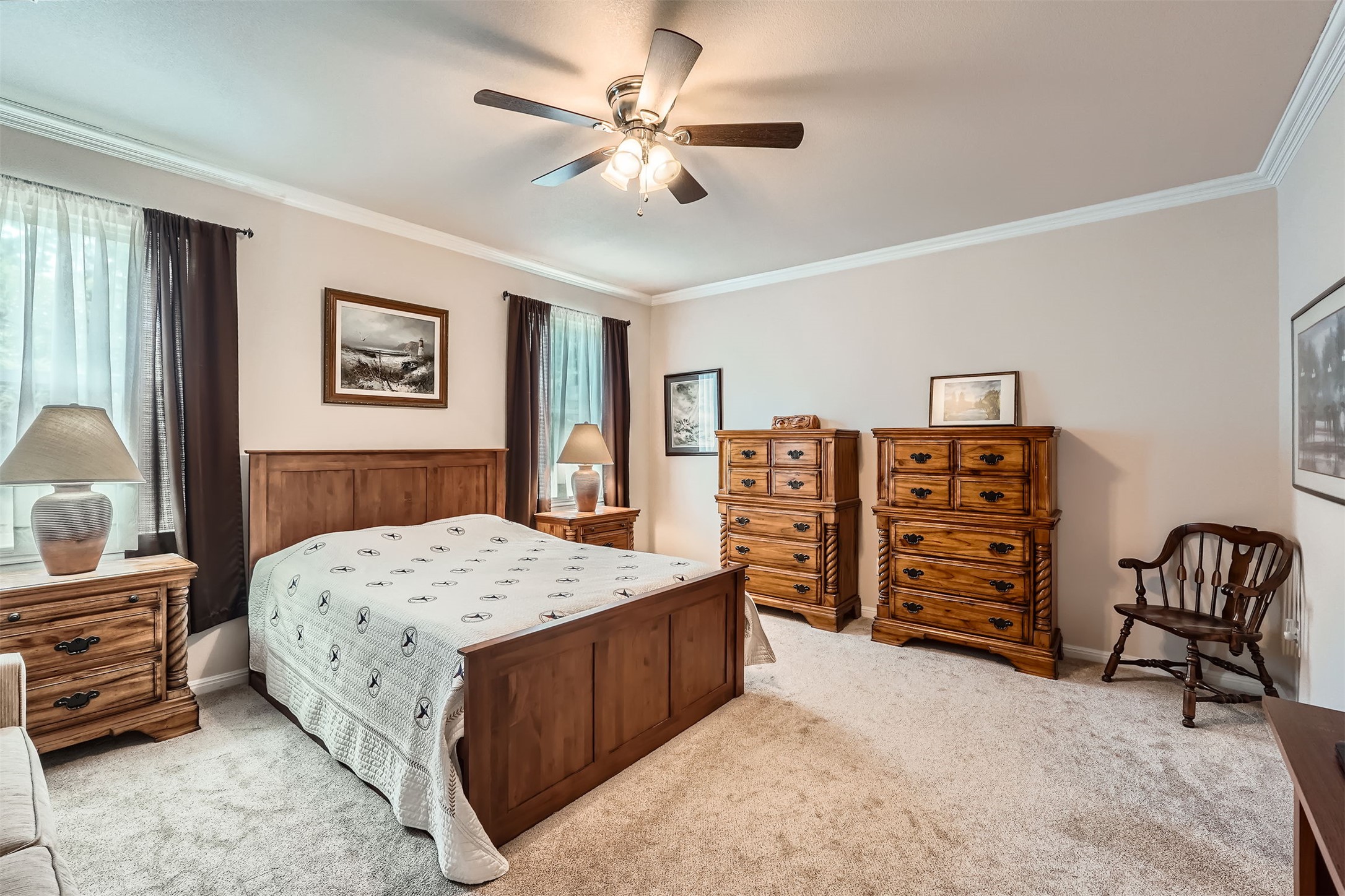 5501 Hitching Post Lago Vista, TX 78645 - Photo 14 of 26 a bedroom with a bed a dresser and book shelfs