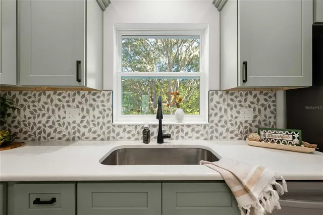 a kitchen with a sink and a window