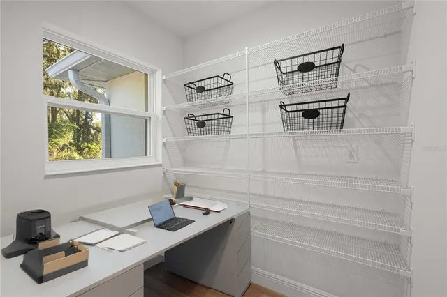 a bathroom with a sink and a window