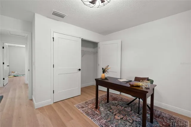 a view of a workspace with furniture