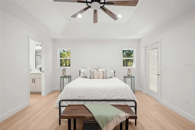 a bedroom with a bed and a table in it