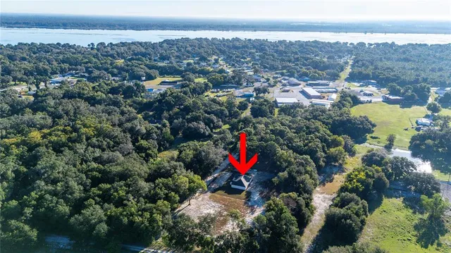 a view of house with yard