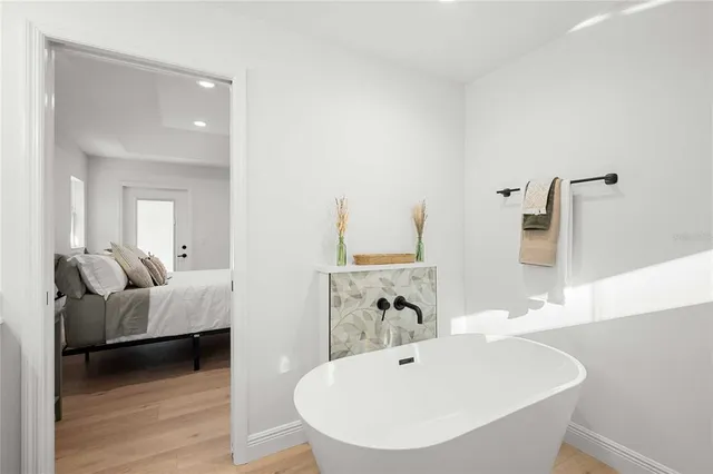 a bathroom with a bathtub and a sink