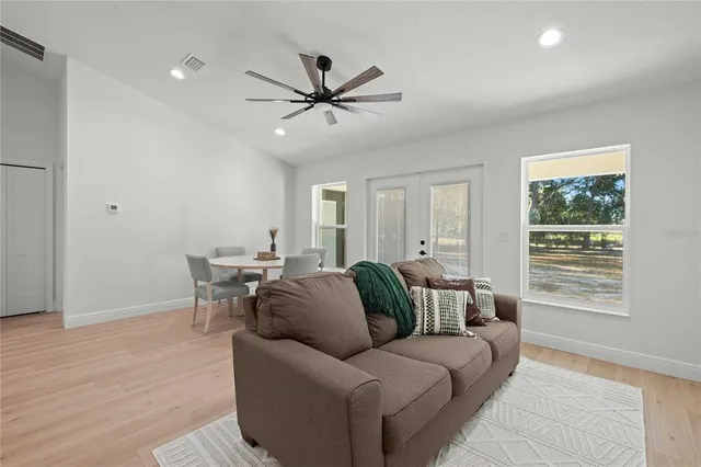 a living room with furniture and a window