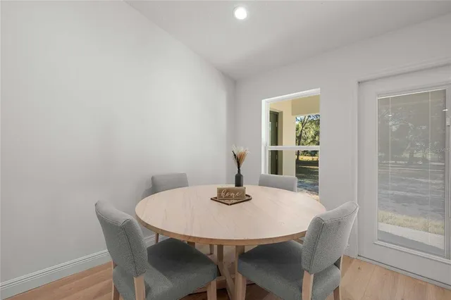 a dining room with furniture and window