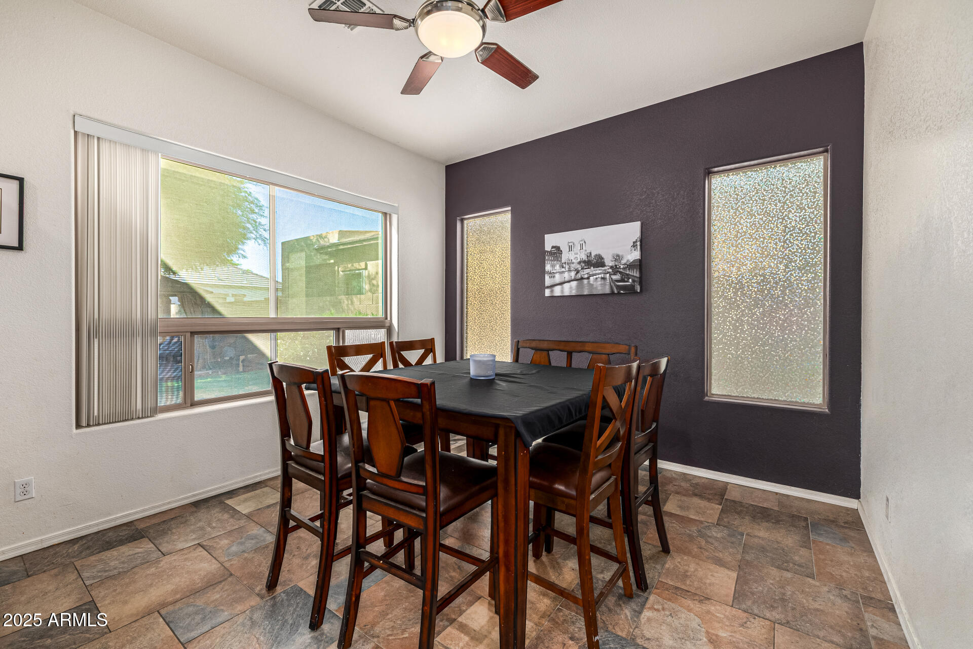 2026 North Rascon Loop Phoenix, AZ 85037 - Photo 13 of 38 a view of a dining room with furniture window and outside view