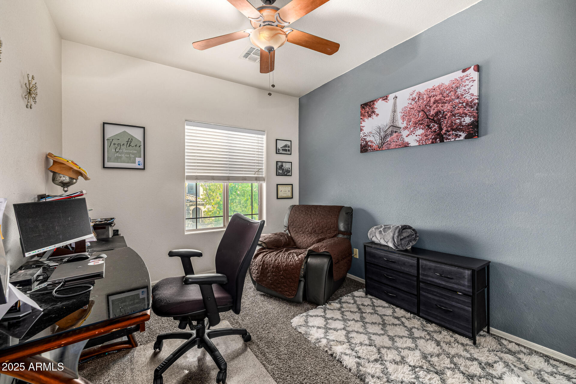 2026 North Rascon Loop Phoenix, AZ 85037 - Photo 17 of 38 a livingroom with workspace and a window