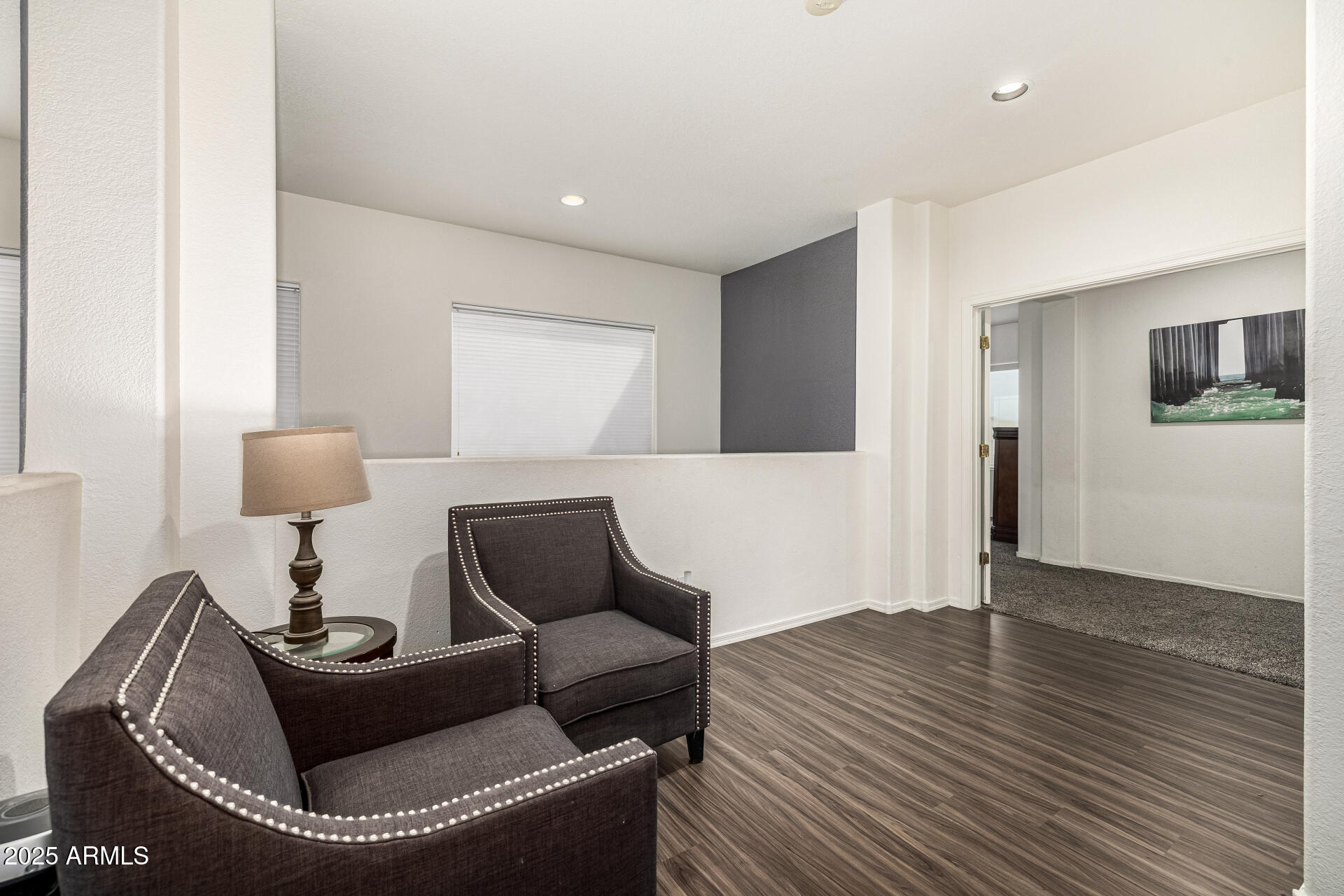 2026 North Rascon Loop Phoenix, AZ 85037 - Photo 22 of 38 a living room with furniture and a wooden floor
