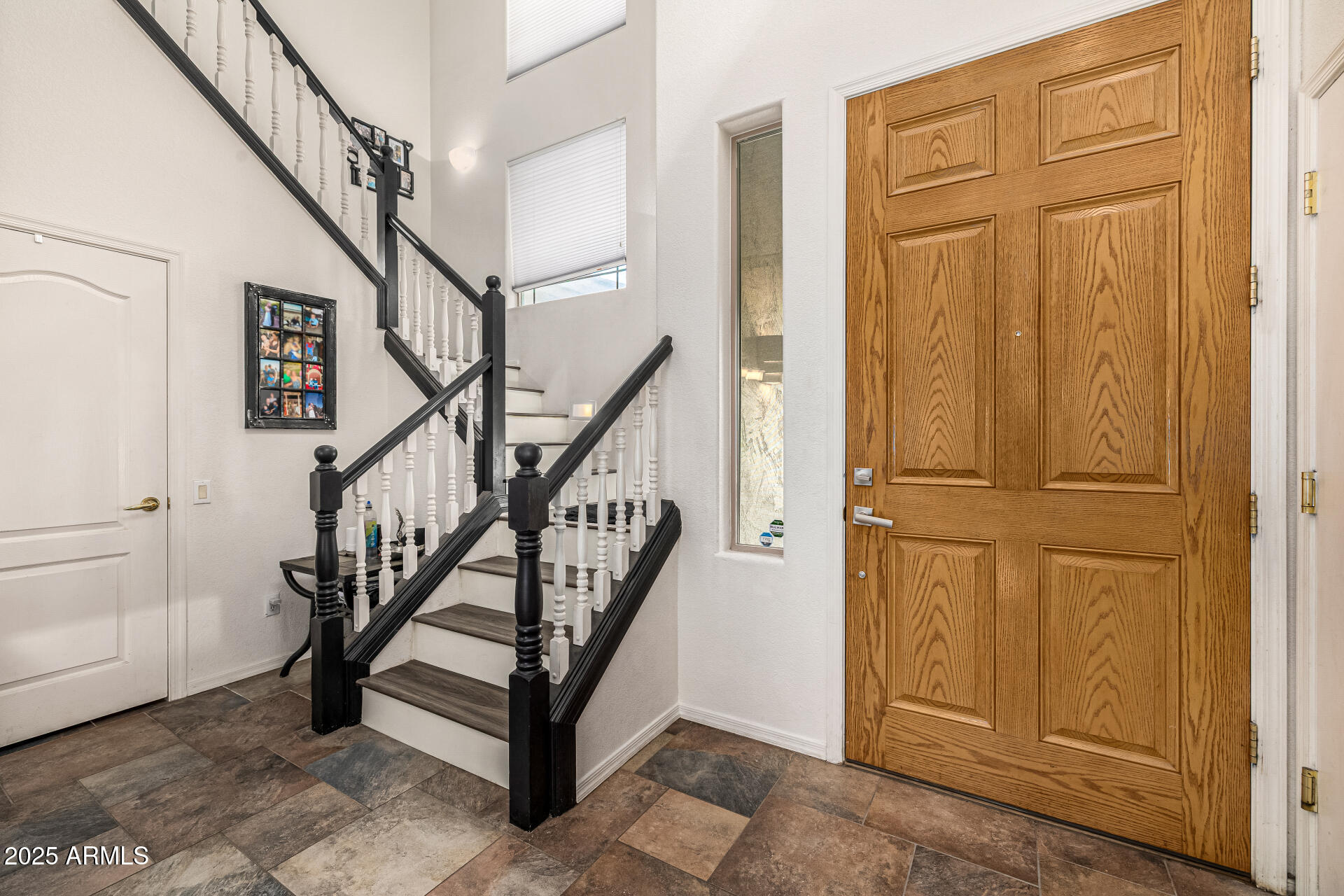 2026 North Rascon Loop Phoenix, AZ 85037 - Photo 6 of 38 a view of an entryway with staircase