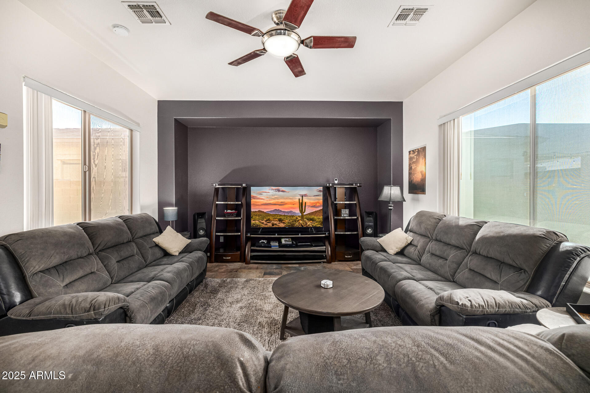 2026 North Rascon Loop Phoenix, AZ 85037 - Photo 8 of 38 a living room with furniture and a flat screen tv