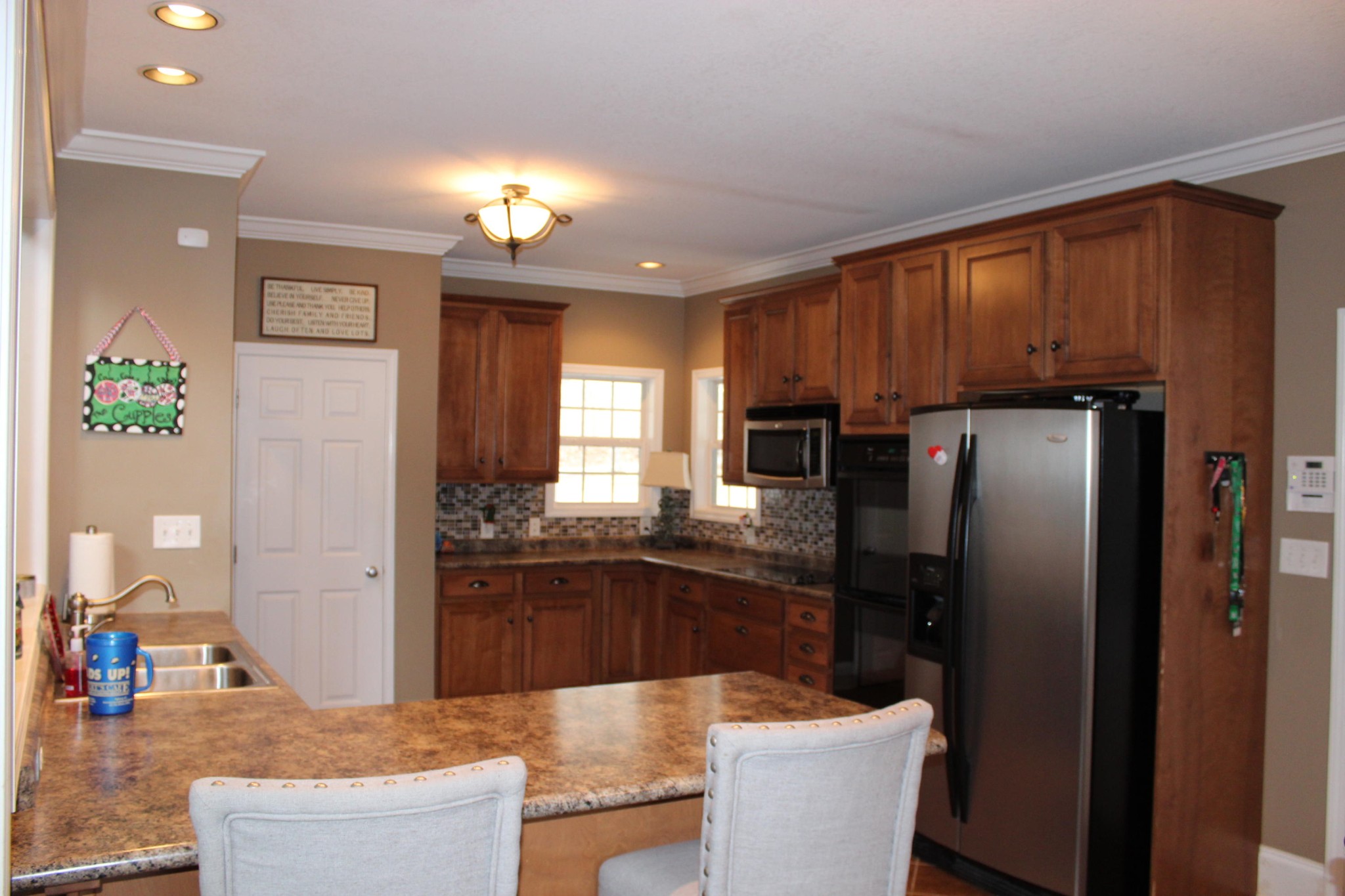 1016 Mountain Road Clinton, TN 37716 - Photo 13 of 30 a kitchen with refrigerator and cabinets