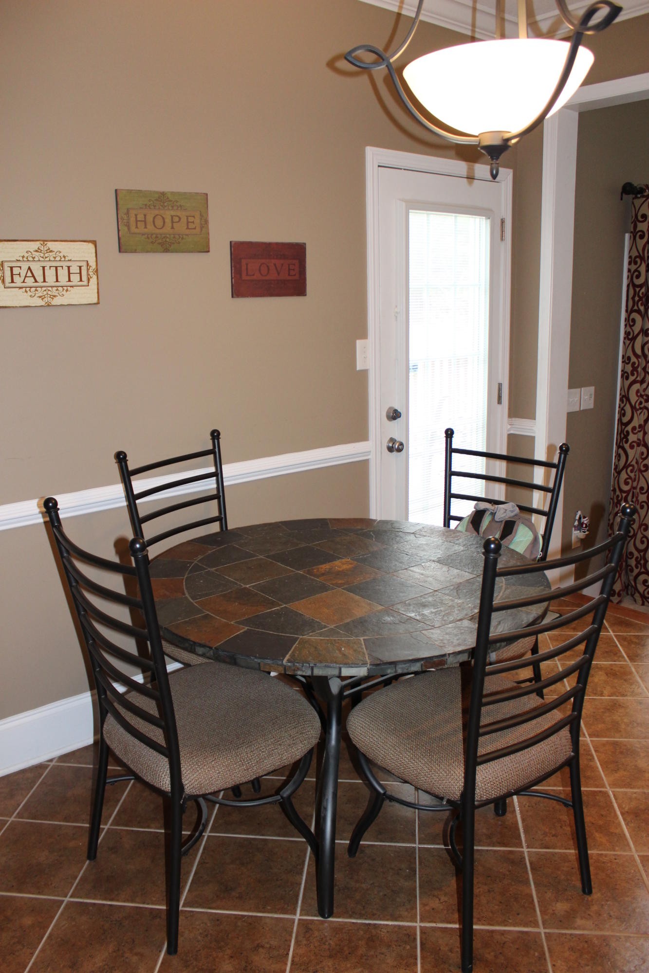 1016 Mountain Road Clinton, TN 37716 - Photo 14 of 30 a view of a dining room with furniture and a chandelier