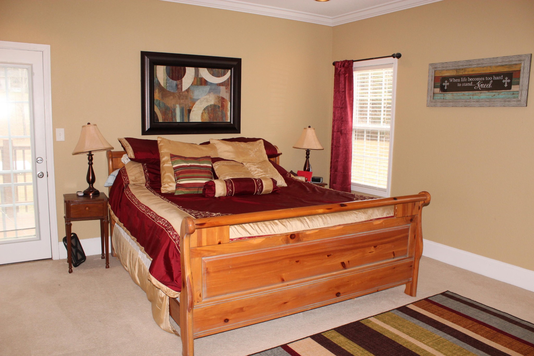 1016 Mountain Road Clinton, TN 37716 - Photo 18 of 30 a bed sitting in a bedroom next to a window