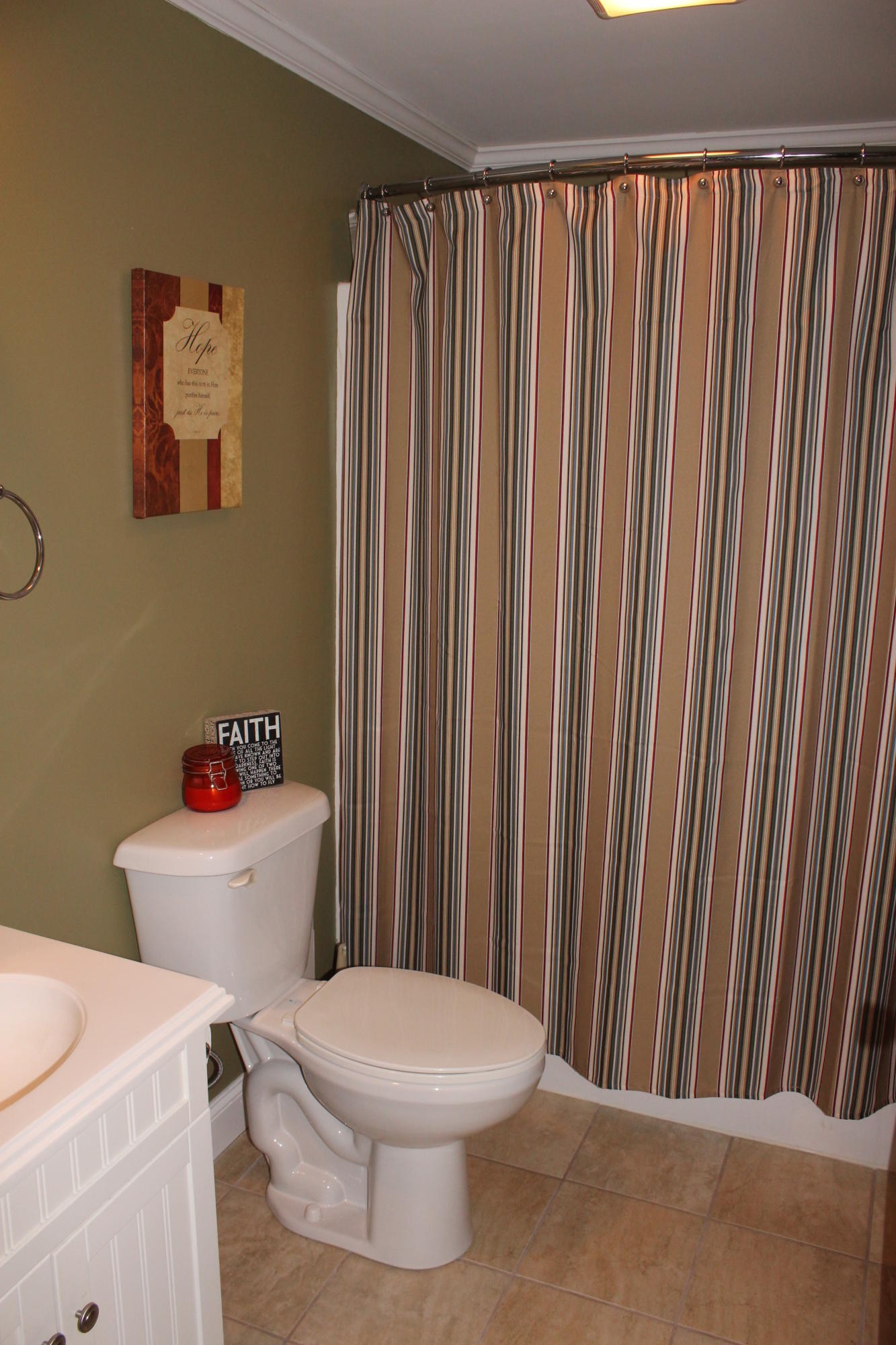 1016 Mountain Road Clinton, TN 37716 - Photo 28 of 30 a white toilet sitting next to a bathroom sink