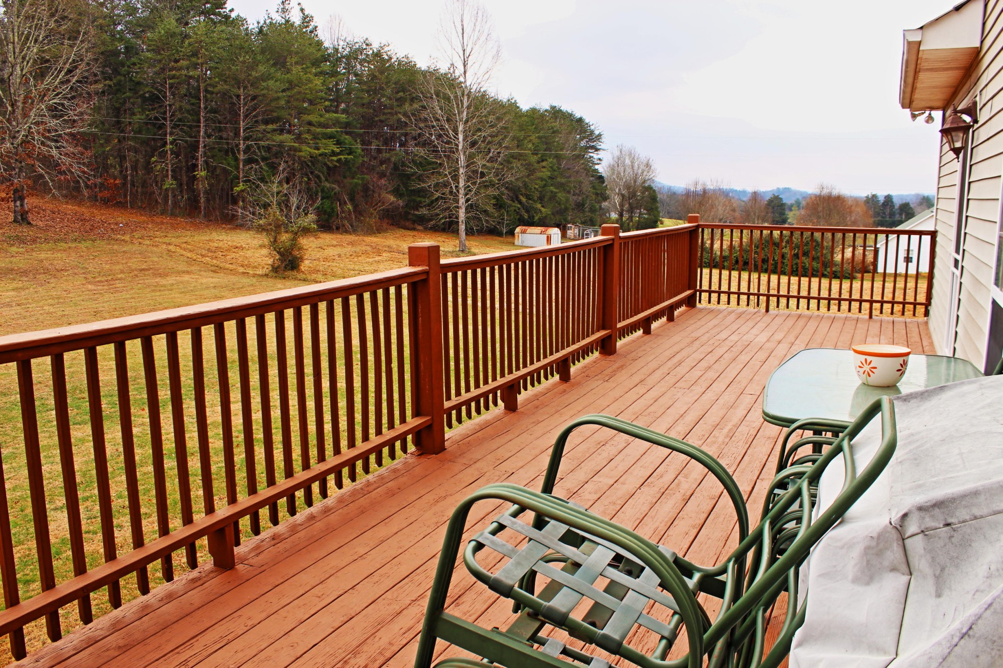 1016 Mountain Road Clinton, TN 37716 - Photo 7 of 30 a balcony with wooden floor table and chairs