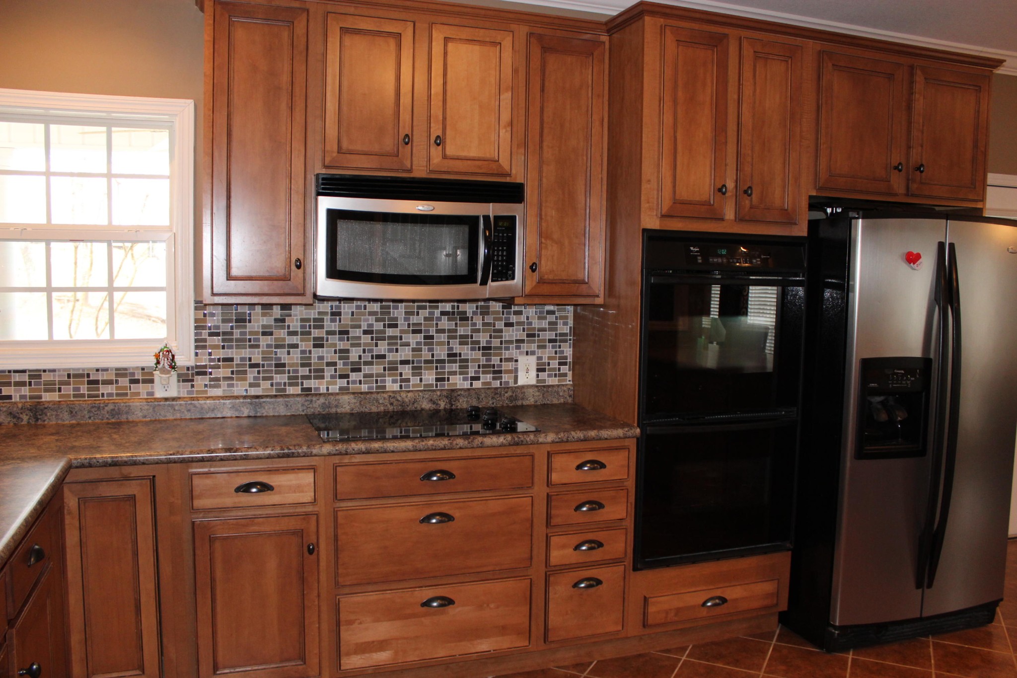 1016 Mountain Road Clinton, TN 37716 - Photo 10 of 30 a kitchen with granite countertop wooden cabinets and stainless steel appliances