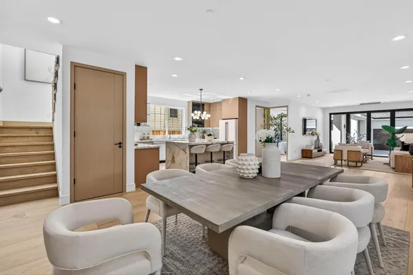 a view of kitchen with dining table and chairs